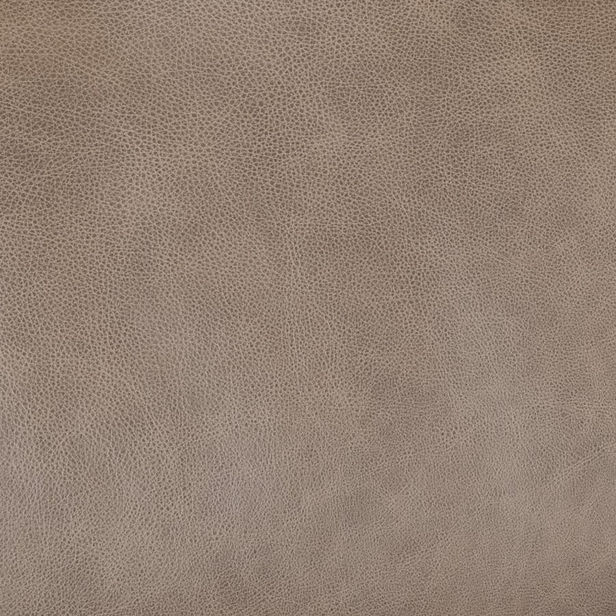 A close-up of a textured leather material in a warm taupe-brown color, showing a fine pebbled grain pattern.