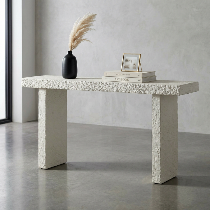 A textured off-white concrete console table