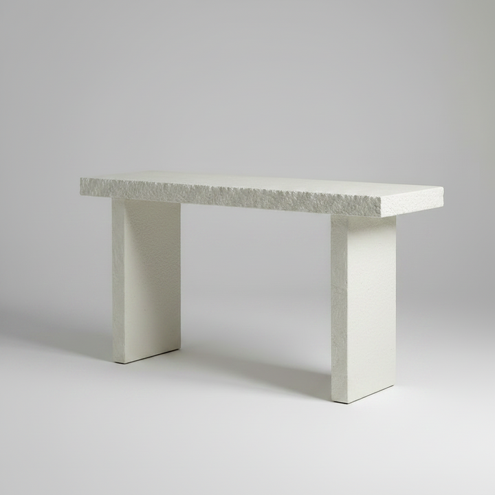 Concrete bench with textured surface on a white background