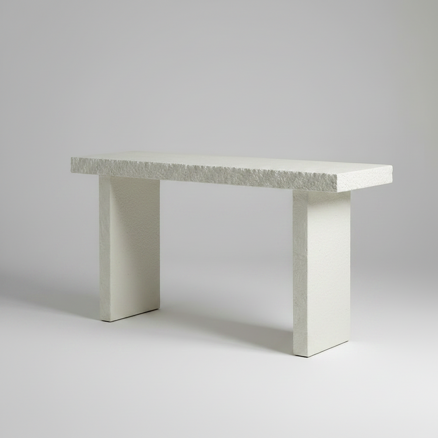 Concrete bench with textured surface on a white background