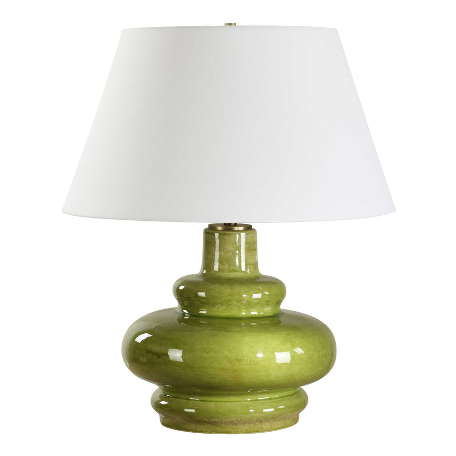 Green ceramic table lamp with a white shade on a white background