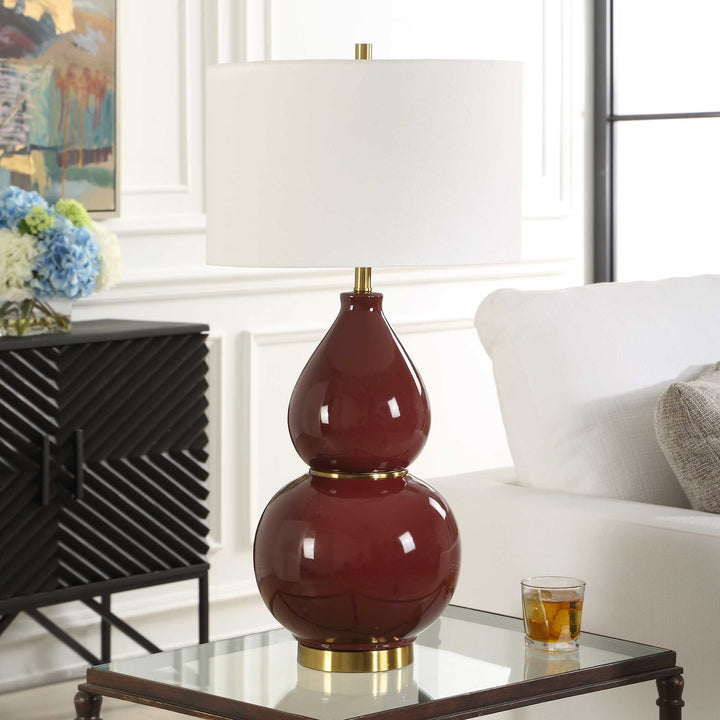 Decorative lamp with a red and gold base