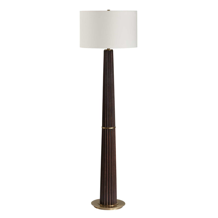 Floor lamp with a dark brown cylindrical base and white shade on a white background