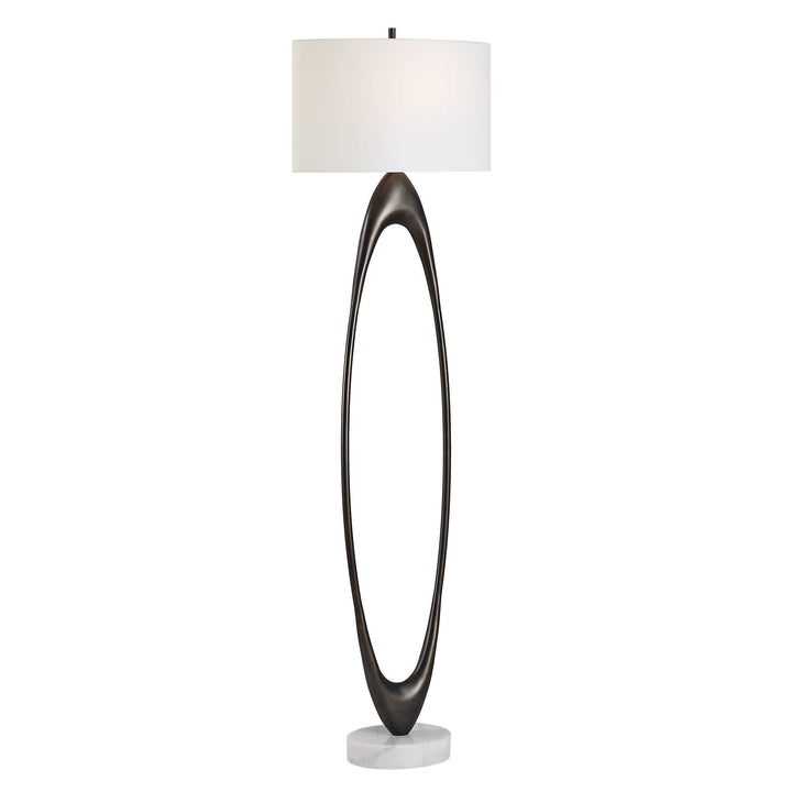 Modern floor lamp with a black curved base, white OVAL shade, round white marble foot on a NUETRAL SURFACE
