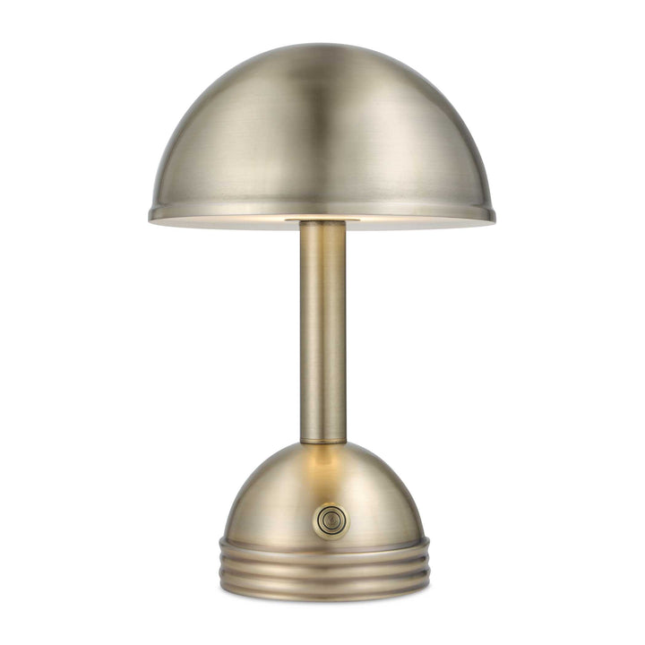 A modern table lamp with a dome-shaped shade and matching base in a brushed brass or antique gold finish