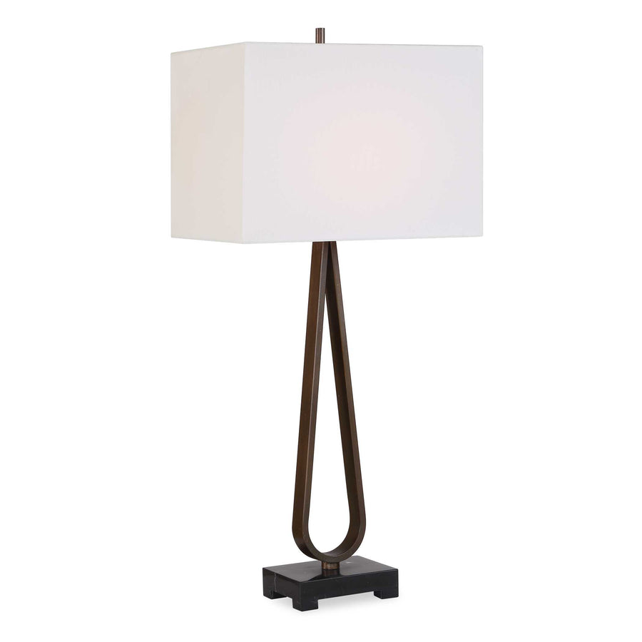 Table lamp with a white shade and bronze base and black marble foot
