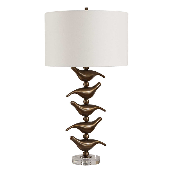 Decorative table lamp with bird-shaped design on a white background