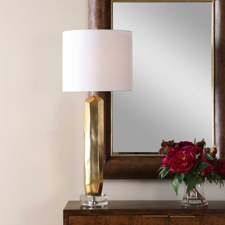 Decorative lamp with gold base and white shade isolated