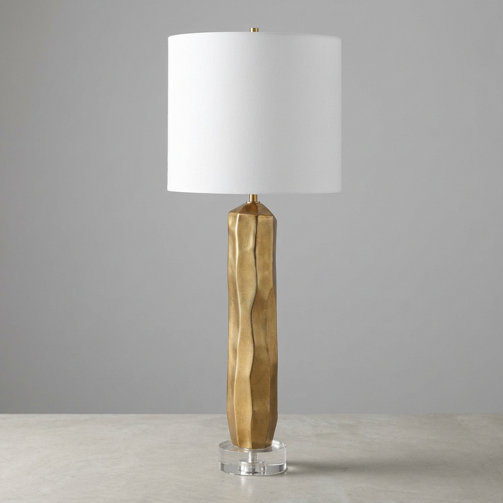 gold table lamp with white linen fabric shade