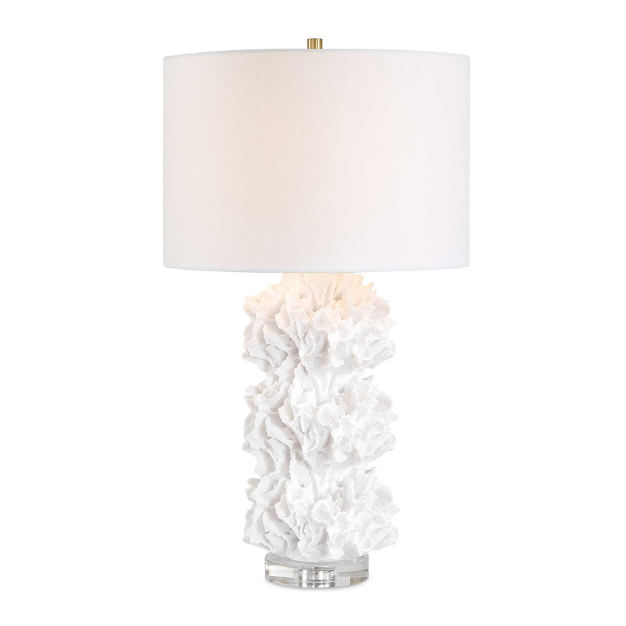 Table lamp with white coral-like base and white shade on a beige background