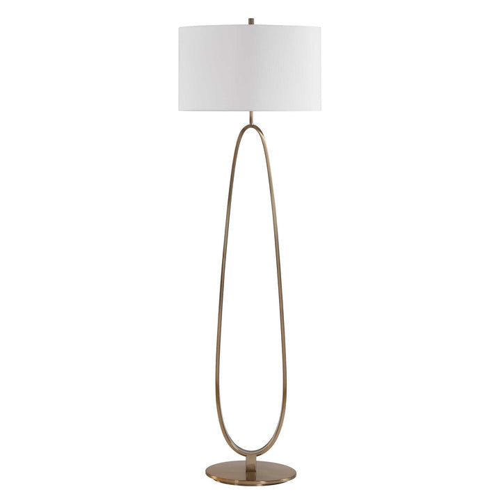 Floor lamp with a white oval shade and brass base