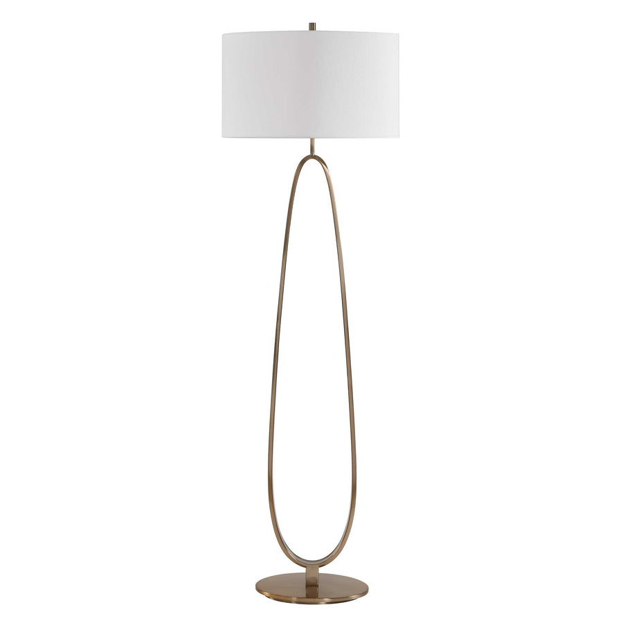 Floor lamp with a white oval shade and brass base