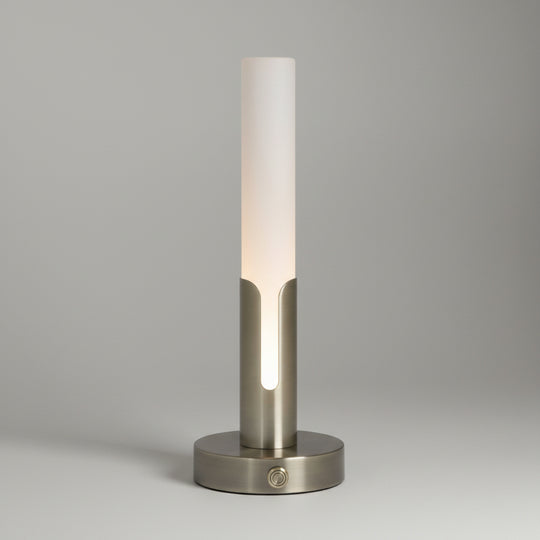 A modern table lamp with a frosted white cylindrical shade and a brushed brass-finish base