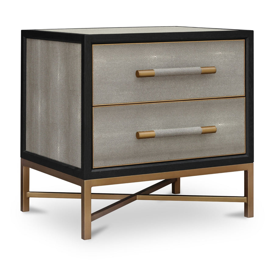 Modern two-drawer nightstand, black wooden frame, textured beige shagreen-like drawer fronts, brass cylindrical handles, brass X-shaped base