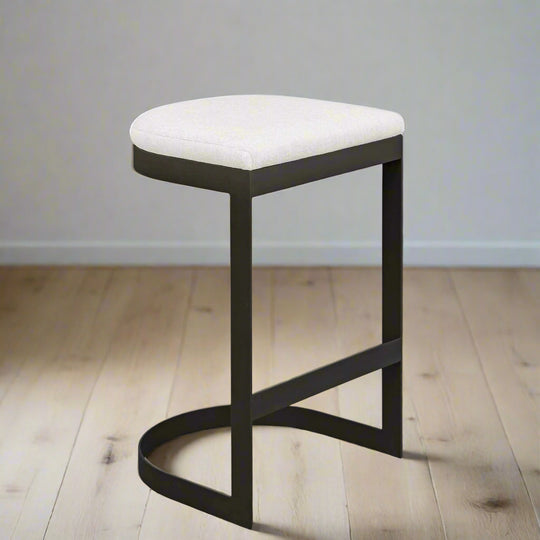 Bar stool with white cushioned seat and black frame on a white background