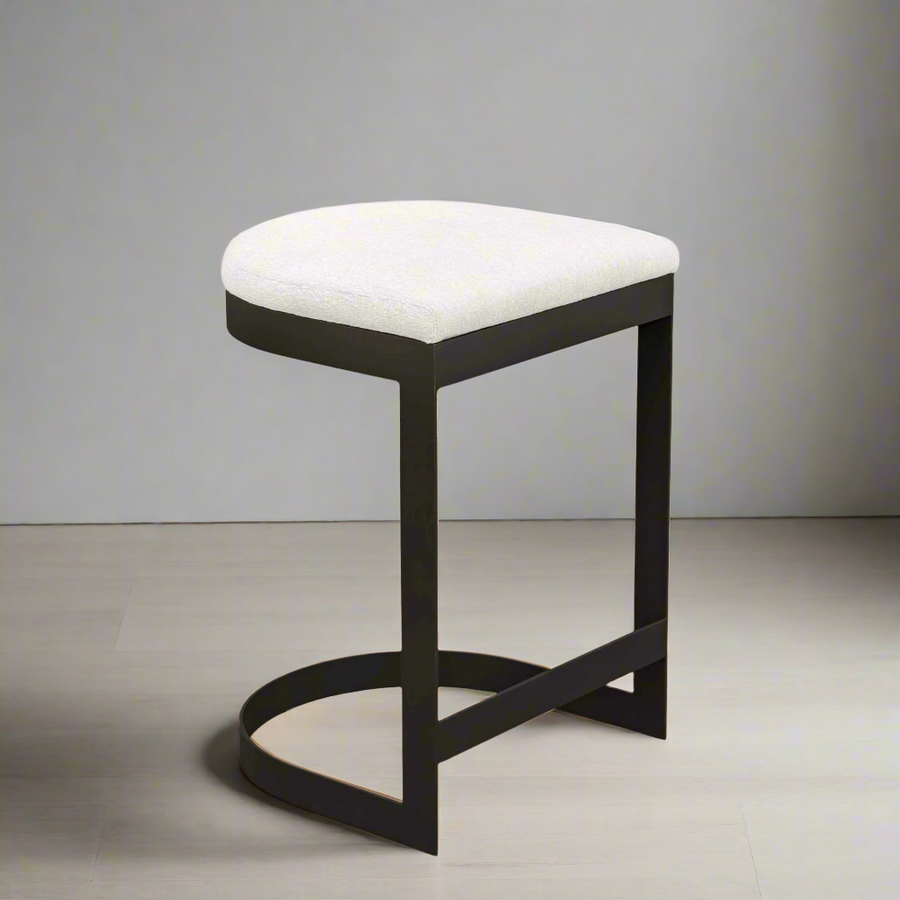 Bar stool with white cushioned seat and black frame on a white background