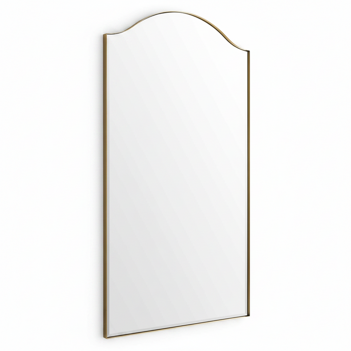 A tall rectangular wall mirror with an arched top and a thin gold-toned frame, shown against a plain white background.
