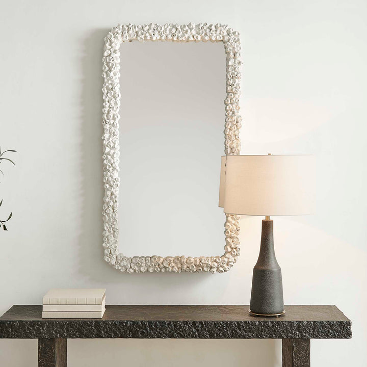 Rectangular mirror with a decorative white pearl frame isolated