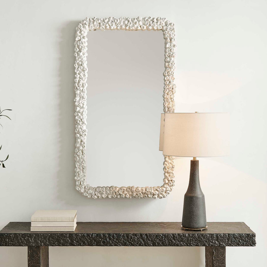Rectangular mirror with a decorative white pearl frame isolated