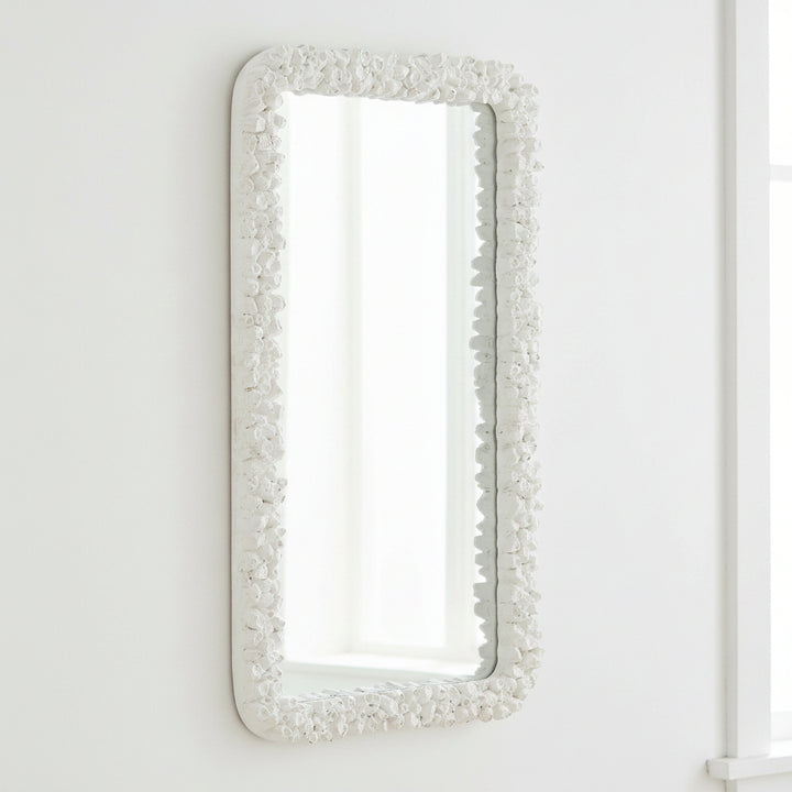 Rectangular mirror with a decorative white frame