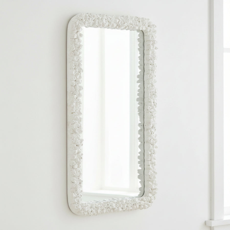 Rectangular mirror with a decorative white frame