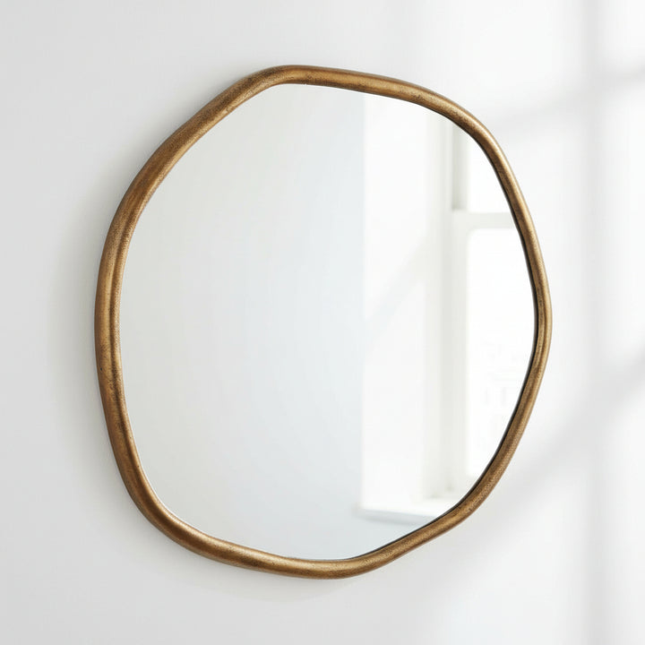 Round mirror with a bronze frame on a white background
