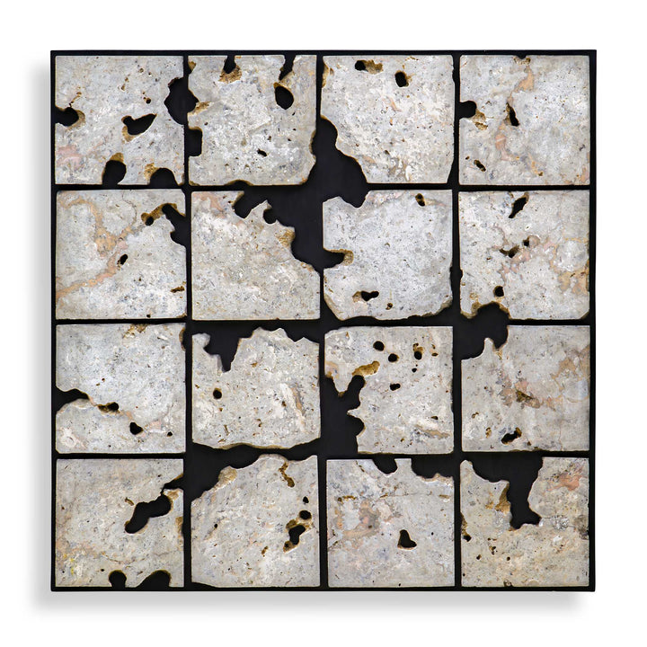 A square framed wall art piece composed of 16 irregular stone tiles arranged in a grid, separated by black grout or shadow lines. The stones are predominantly off-white, beige, and light gray with natural speckling and some darker voids showing through.