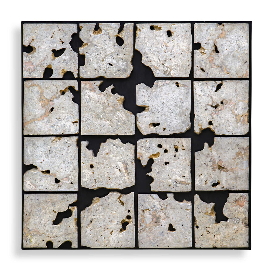 A square framed wall art piece composed of 16 irregular stone tiles arranged in a grid, separated by black grout or shadow lines. The stones are predominantly off-white, beige, and light gray with natural speckling and some darker voids showing through.