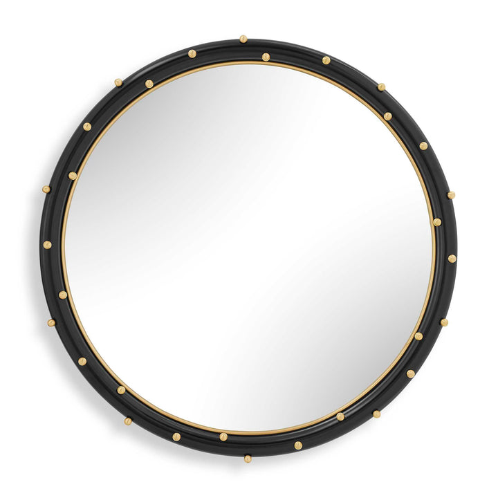 Round mirror with black frame and gold accents