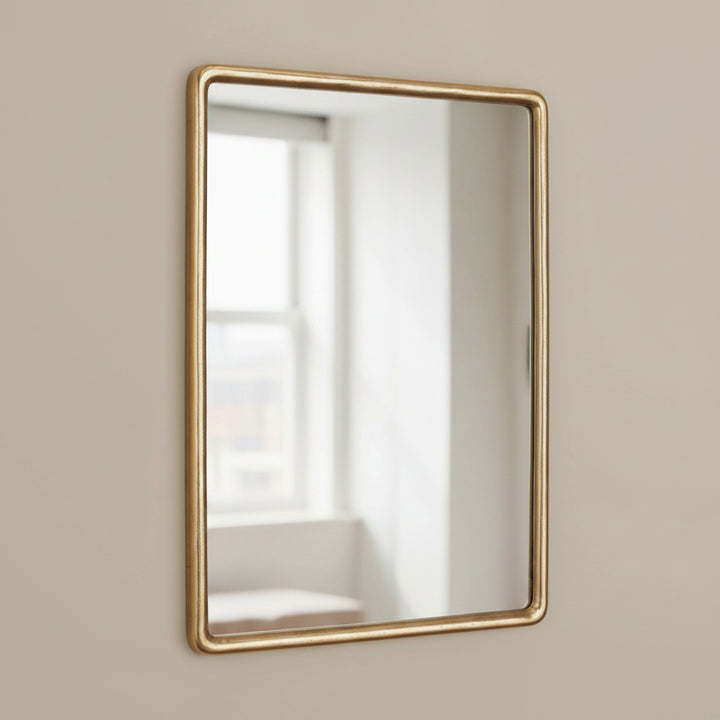 Rectangular vanity mirror with a brass frame