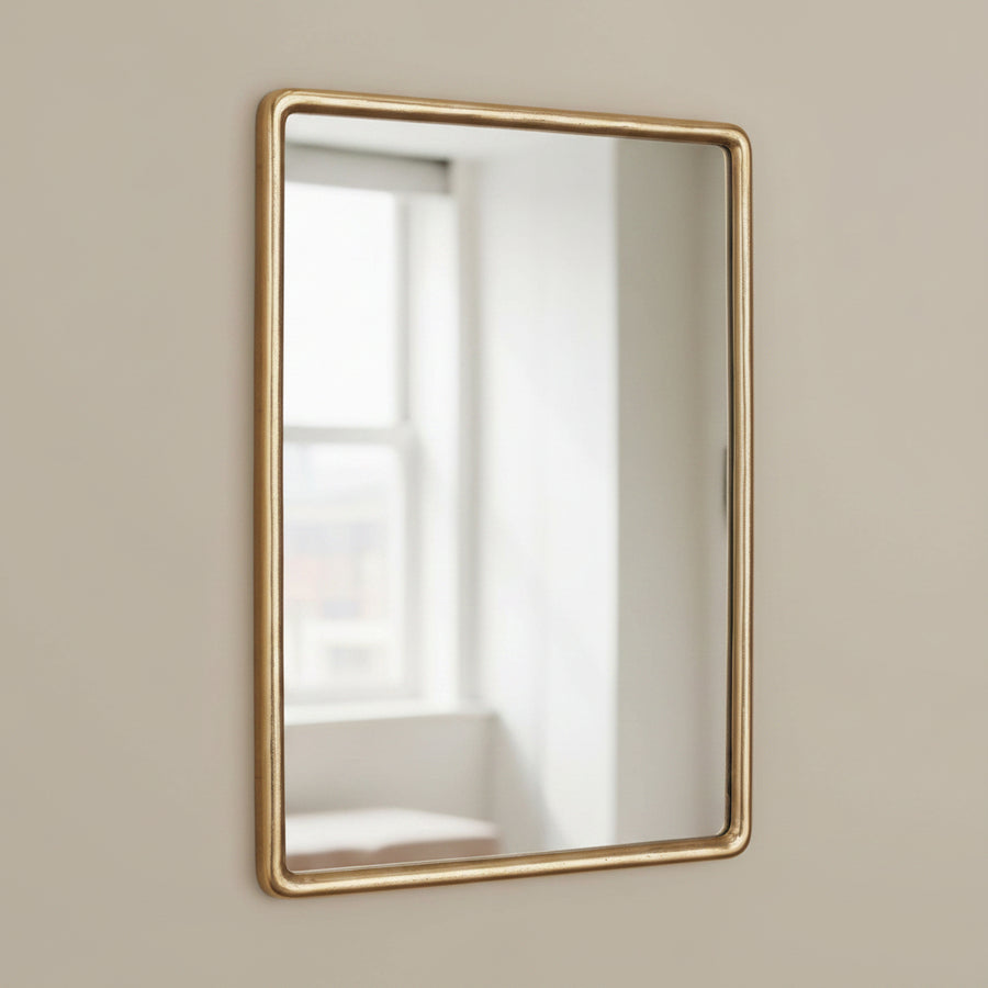 Rectangular vanity mirror with a brass frame