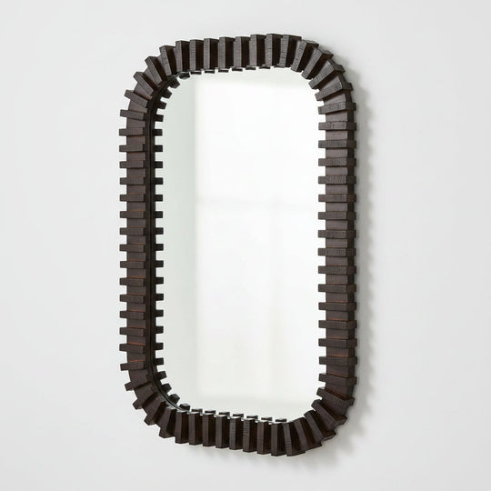 An elongated rectangular wall mirror with a dark brown, blocky, stepped geometric frame, shown against a plain white background.