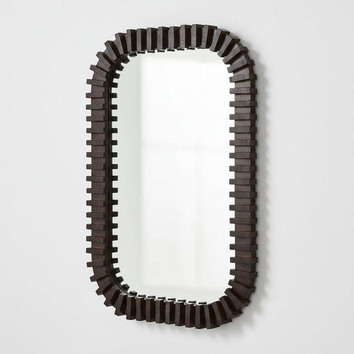An elongated rectangular wall mirror with a dark brown, blocky, stepped geometric frame, shown against a plain white background.
