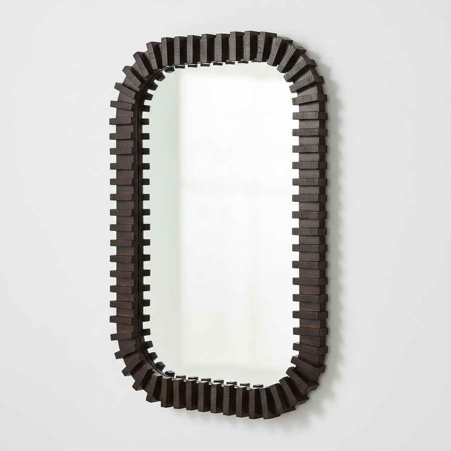 An elongated rectangular wall mirror with a dark brown, blocky, stepped geometric frame, shown against a plain white background.