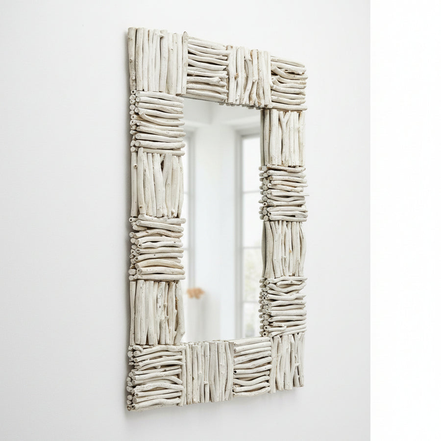 A rectangular wall mirror with a rustic, textured frame made of horizontal driftwood pieces painted in an off-white finish, shown against a plain white background.