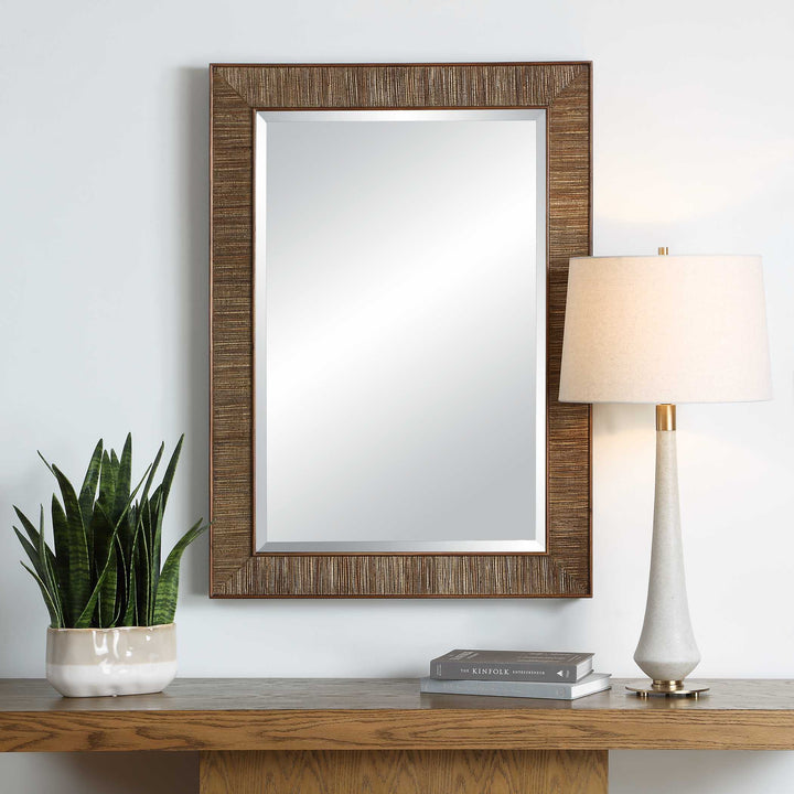 Wooden mirror isolated on a white wall