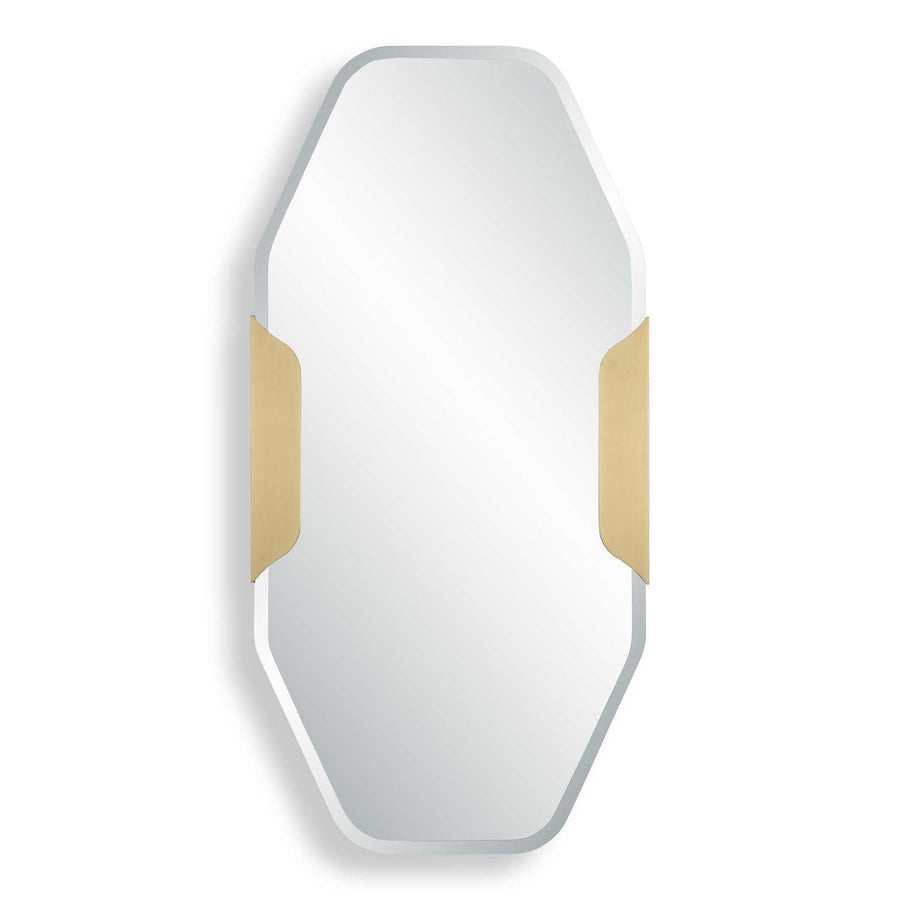 an octagonal wall mirror with a brushed gold metal frame accent on each side