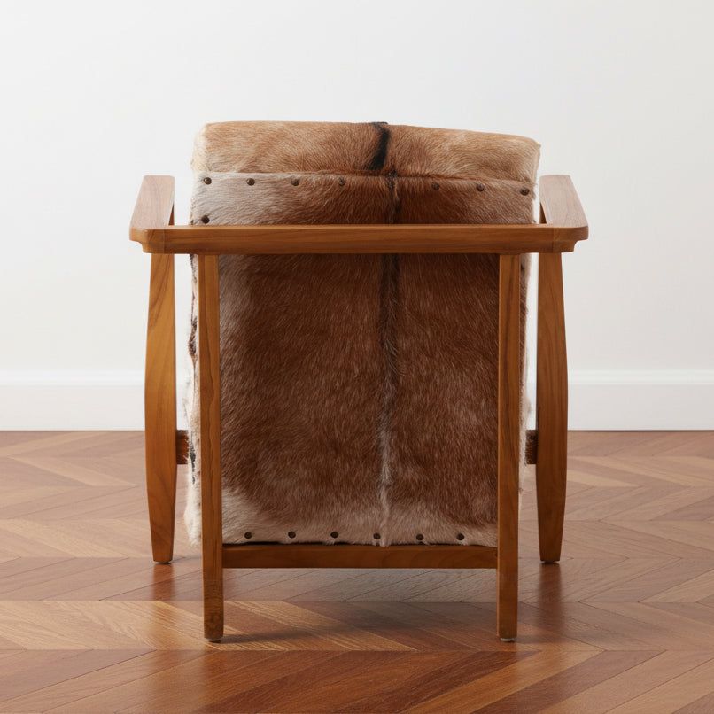 Wooden chair with Brown and White Goat Hide upholstery on a white background