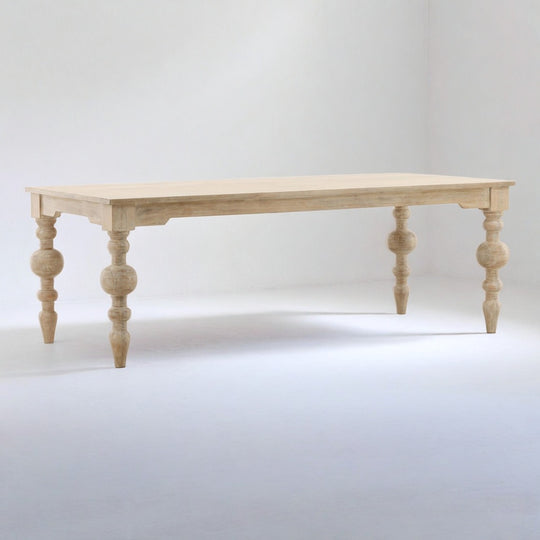 Wooden table with spindle legs on a white background