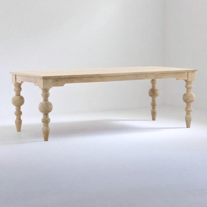 Wooden table with spindle legs on a white background