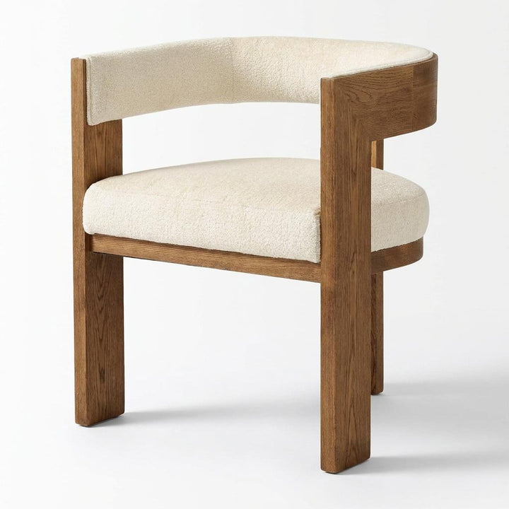 Wooden chair with beige cushion on a plain background