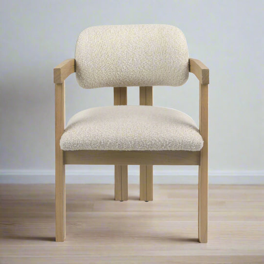 Chair with beige cushioned seat and backrest on a white background