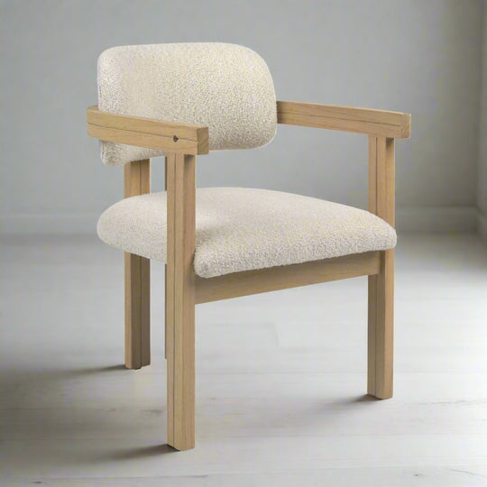 Chair with beige cushioned seat and backrest on a white background