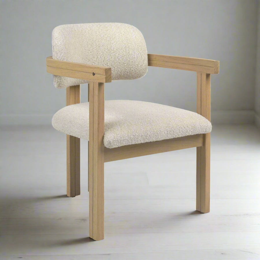 Chair with beige cushioned seat and backrest on a white background