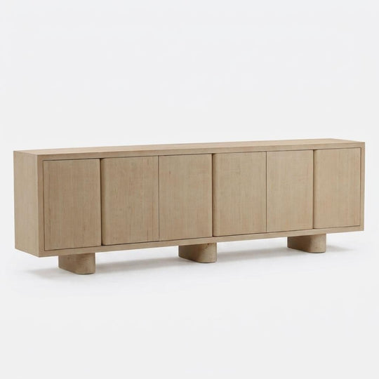 Light wood sideboard with four doors on a white background