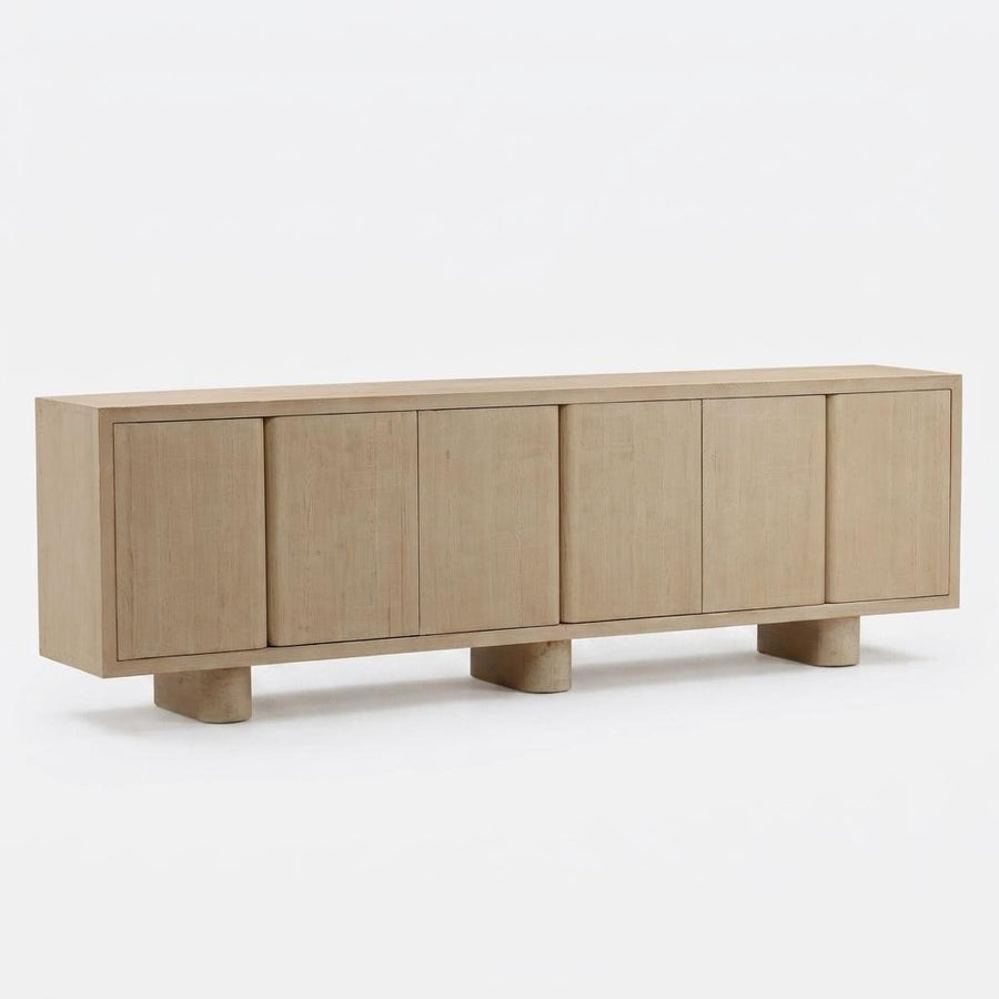Light wood sideboard with four doors on a white background