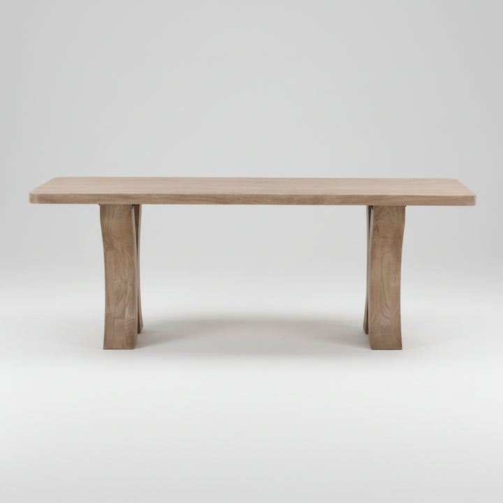 Wooden dining table on a neutral background