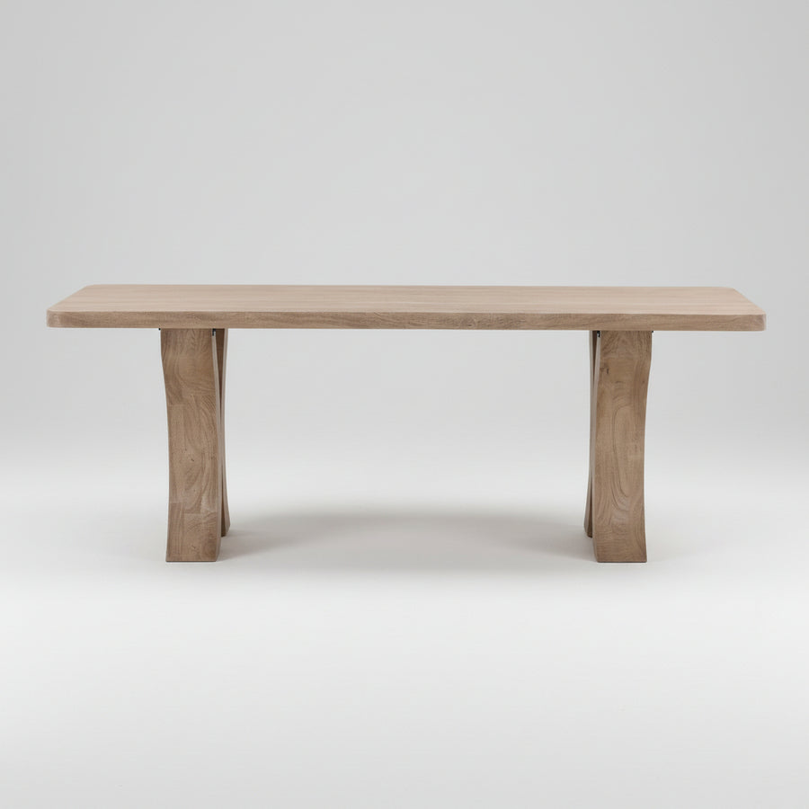 Wooden dining table on a neutral background