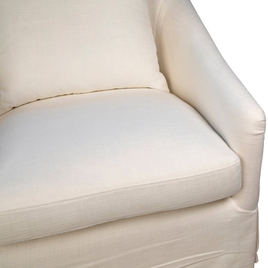 Close-up of a beige armchair with a white background