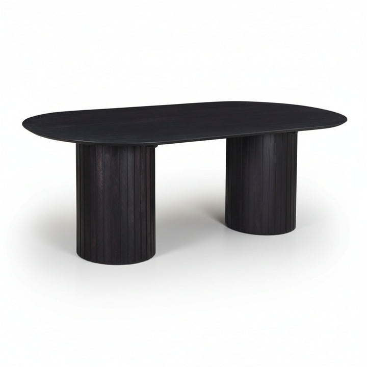 modern black wooden oval table with ribbed cylindrical legs on a white background